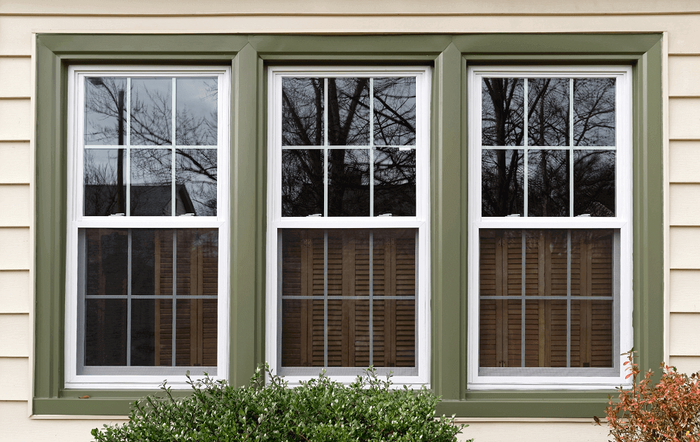 White and green replacement windows on new Wisconsin home