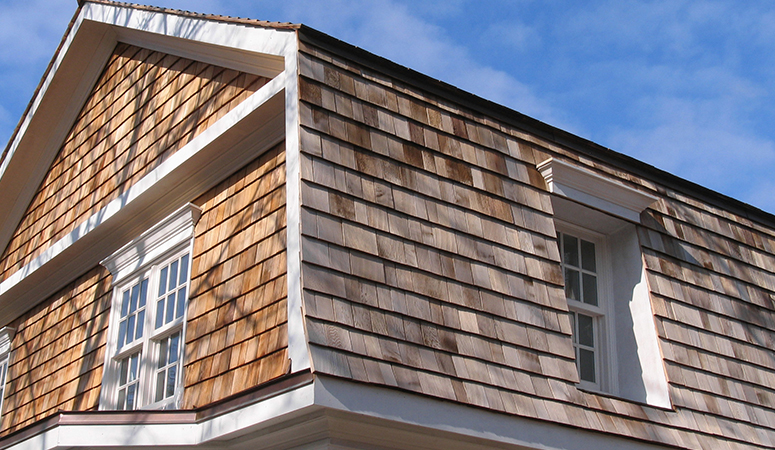 New cedar siding installed on Green Bay residential home