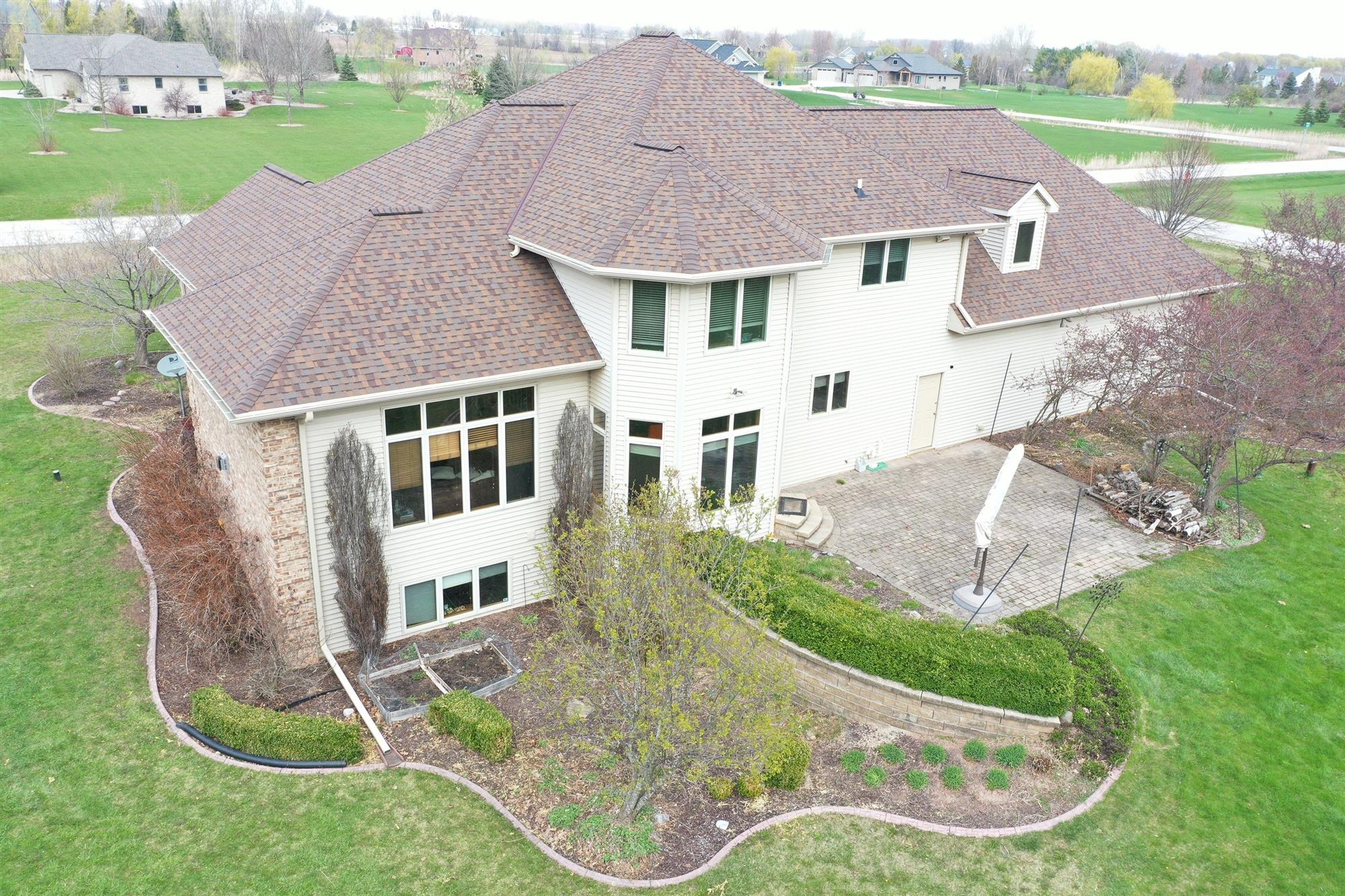 Brown Shingle Asphalt Roof Replacement on large home in Green Bay, WI
