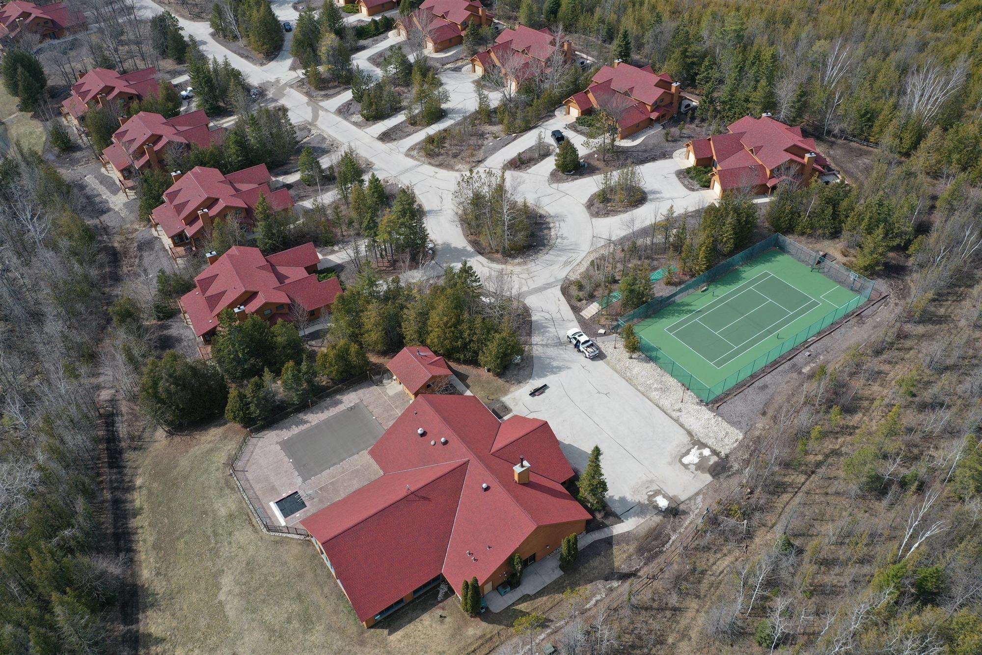 Multiple homes with new asphalt roofs installed by Overhead Solutions in Green Bay, WI