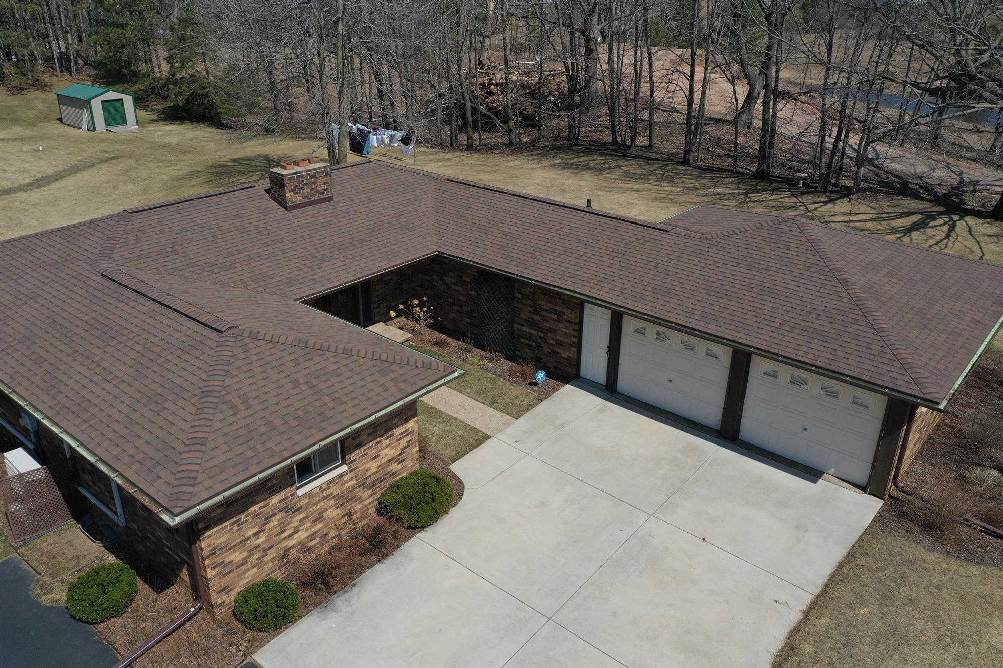 Brown asphalt shingles on a single story home in Green Bay, WI