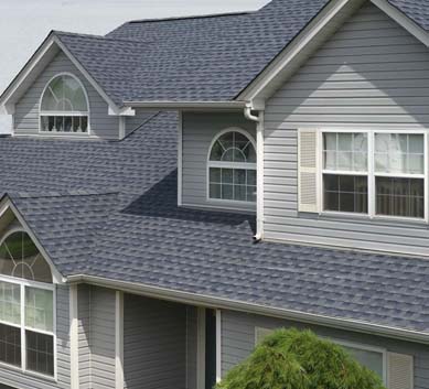 Installation of  Biscayne Blue Shingles on house