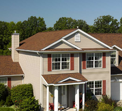 Installation of  Burnt Sienna Shingles on house