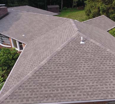 Installation of  Mission Brown Shingles on house
