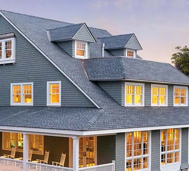 Installation of  Oyster Gray Shingles on house