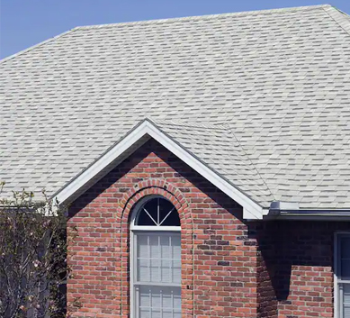 Installation of  White Shingles on house