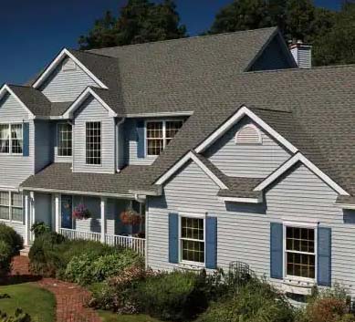 Installation of  Williamsburg Slate Shingles on house