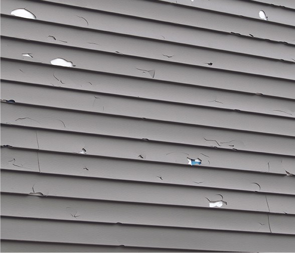 Siding damaged by an ice dam